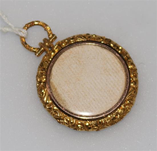 A late 19th/early 20th century gold mounted pendant locket, 30mm.